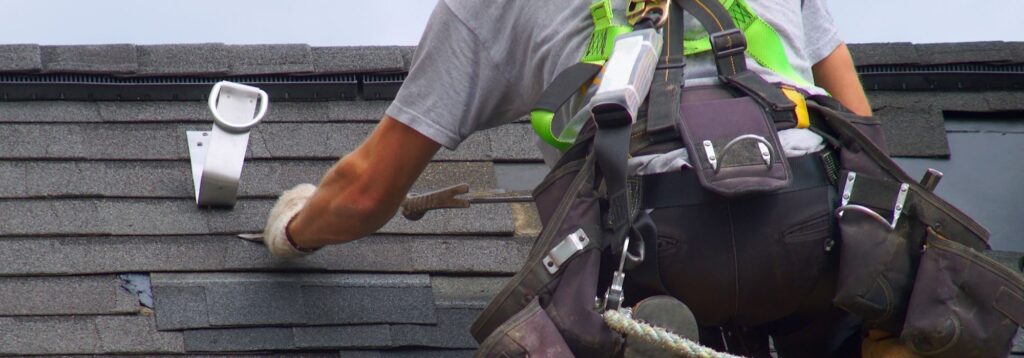 Roof tile repair and external wall painting by rope access